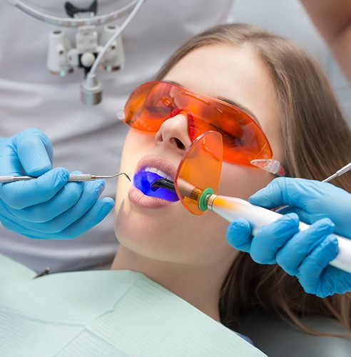 Dental patient receiving a tooth-colored filling