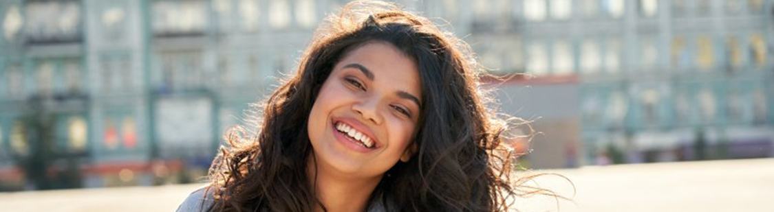 Lady smiles outside