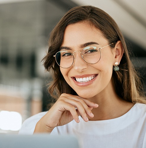 Close-up of woman with glasses smiling